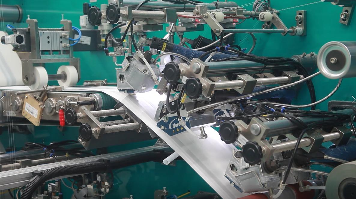 Diaper and sanitary pad production line