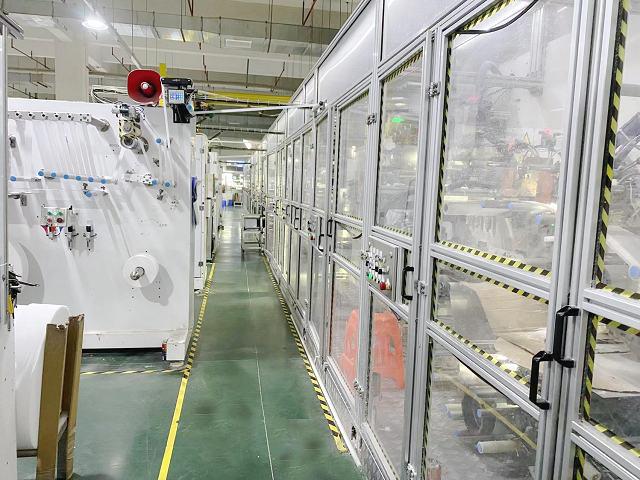 Female diaper manufacturing machine