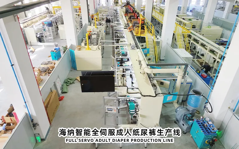 Adult diaper production line with wide material handling and converting zones