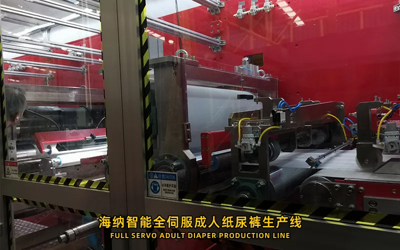Adult diaper machine access zones for operation and maintenance