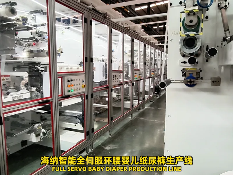 Baby diaper manufacturing machine with multiple web processing sections