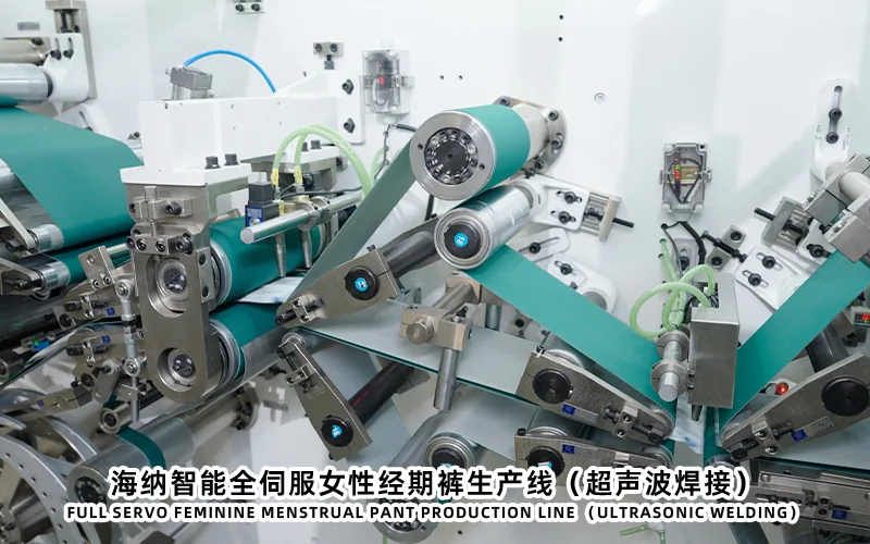 Menstrual pants machine modules for web control and component assembly