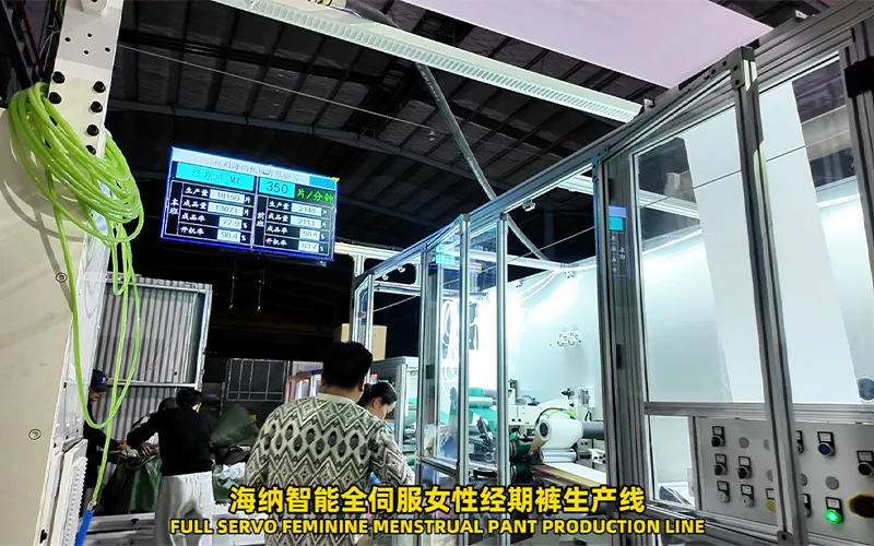 Menstrual pants production line with connected converting stations