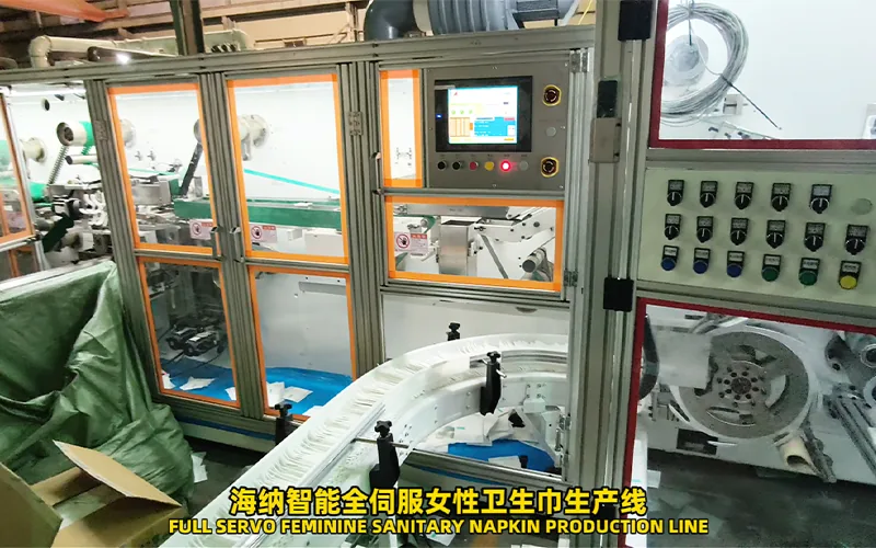 Sanitary pad line material unwind and production flow area