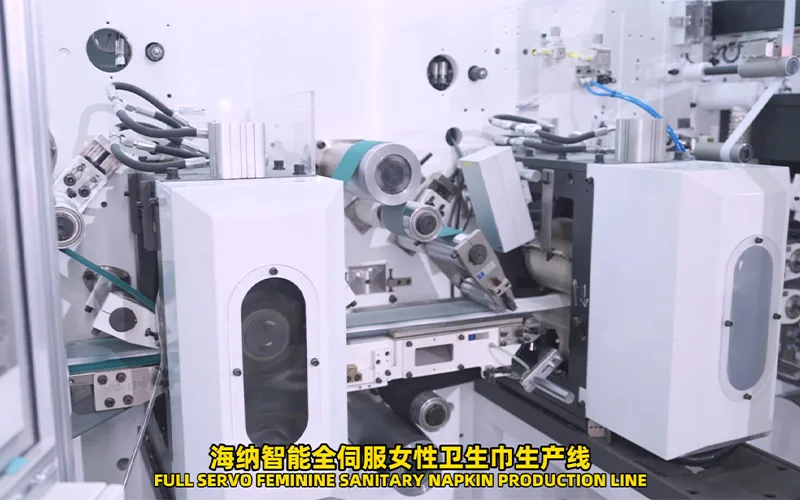 Automatic sanitary pad machine process modules and operator access