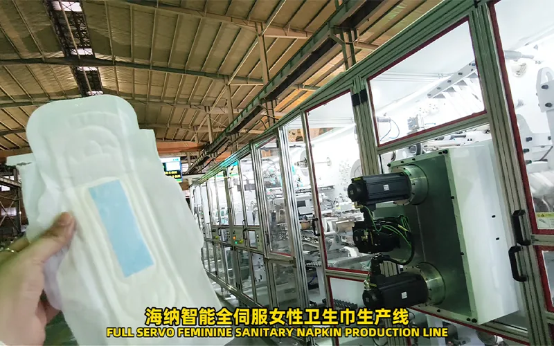 Sanitary napkin production line sections arranged for material feeding and converting